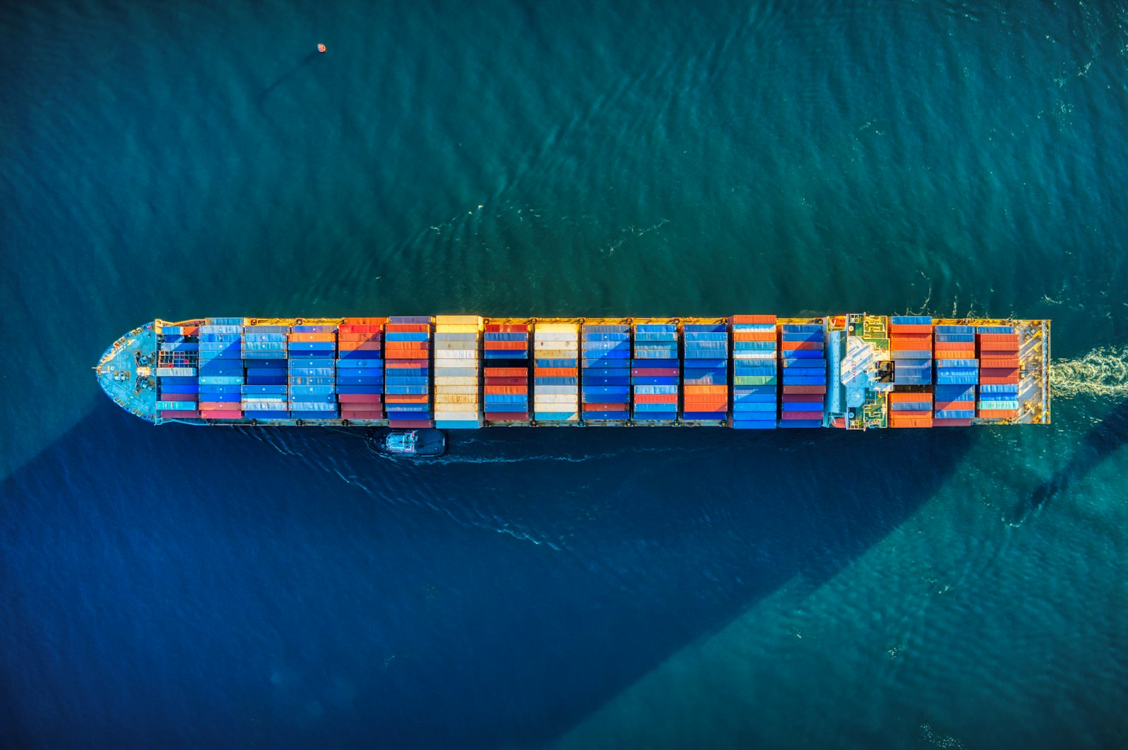 Container ship loaded with cargo at sea