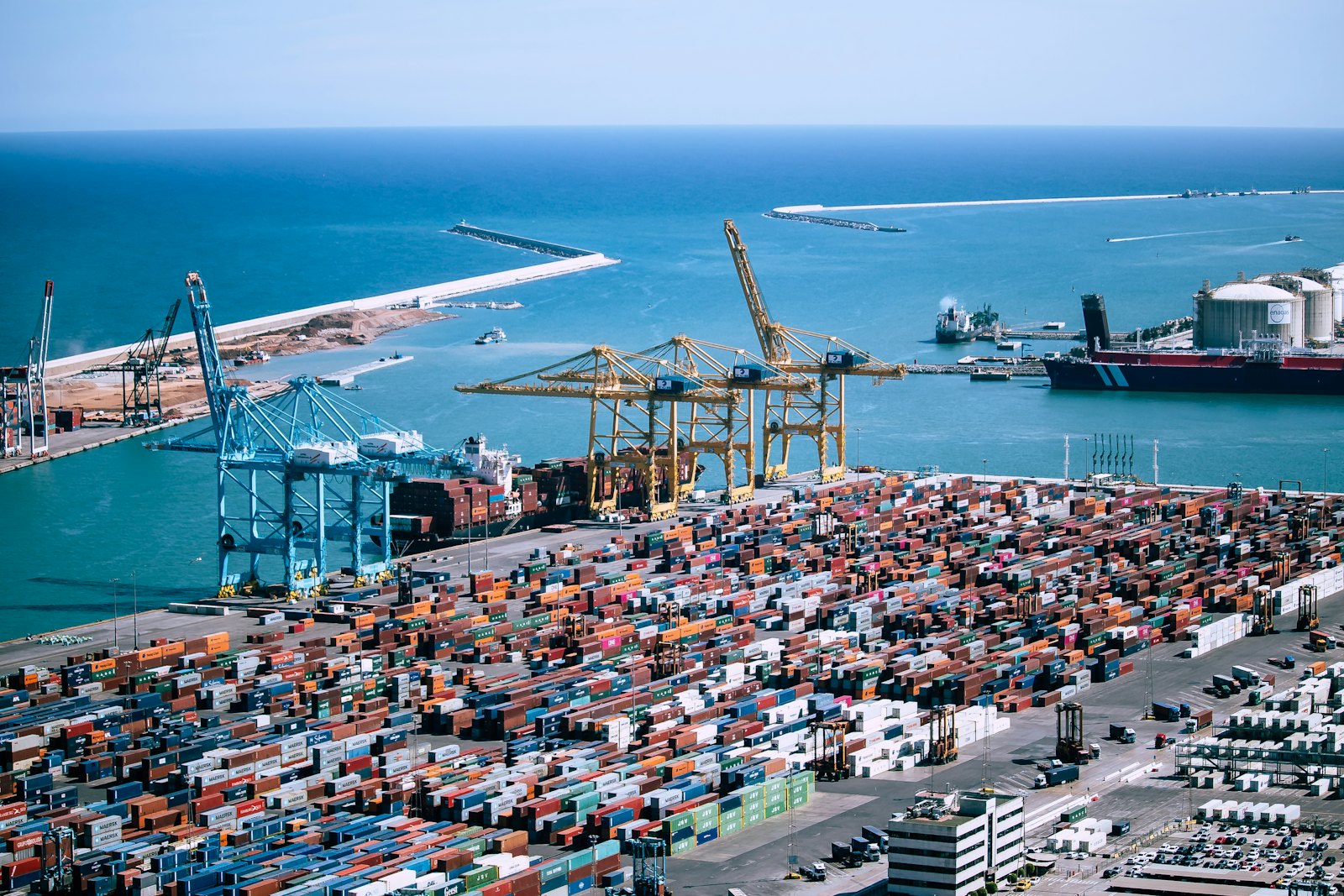 Cranes loading containers at a shipping port terminal